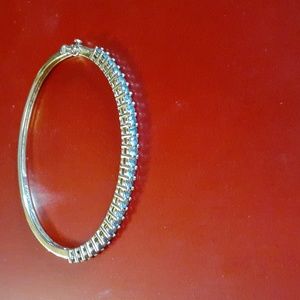 Vintage 925 gold plated bangle bracelet with lite blue stones set in it